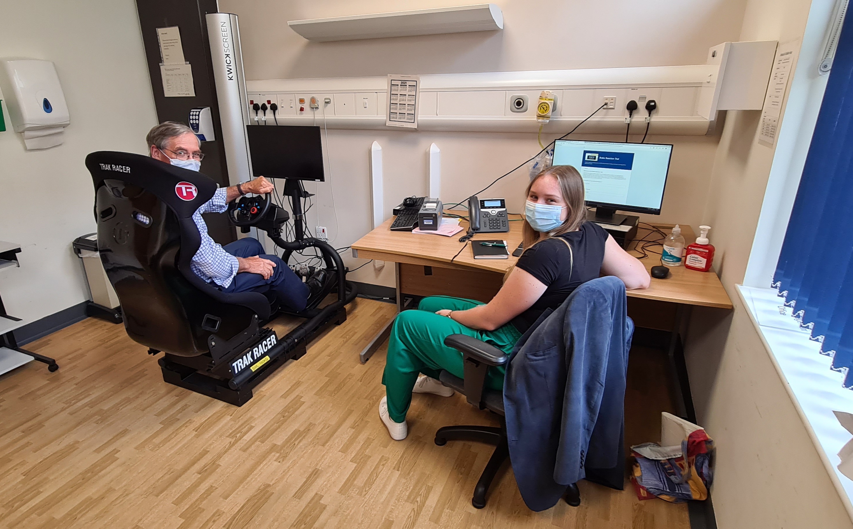 Mr Stewart in the chair with Susie Crayton Research intern.jpg